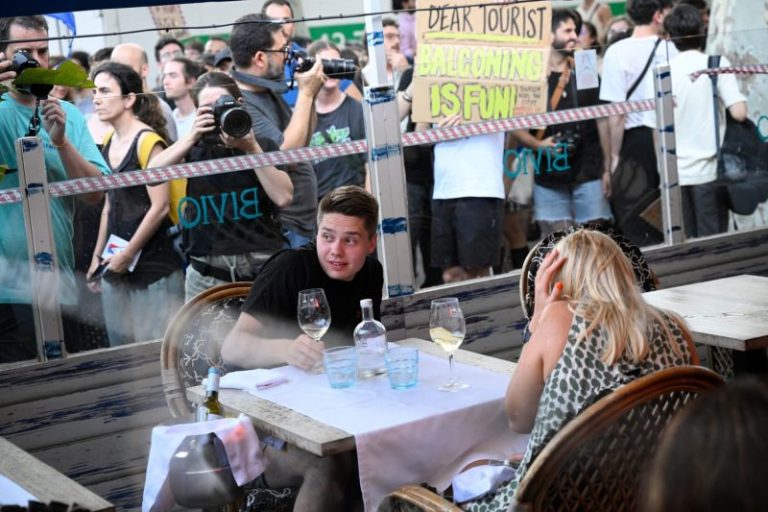 Barcelona protesters throw items and spray travelers with water while shouting ‘tourists go home’